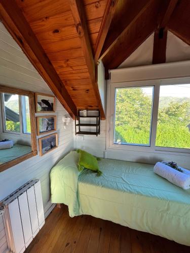 Ένα ή περισσότερα κρεβάτια σε δωμάτιο στο Refugio Giardino