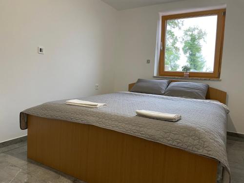 Ένα ή περισσότερα κρεβάτια σε δωμάτιο στο Zerko Holiday Apartment MARJETKA with WELLNESS bookable separately