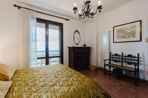 a bedroom with a bed and a window at Ciciliana in Valderice