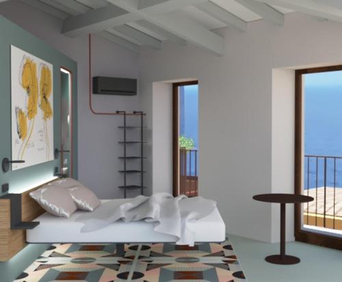a white room with a bed and a balcony at Hotel Gianni Franzi in Vernazza