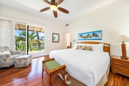 a bedroom with a large white bed and a couch at Kapalua Bay Villas 32B4 · KBV 32B4 Oceanfront Kapalua Spectacula in Kahana