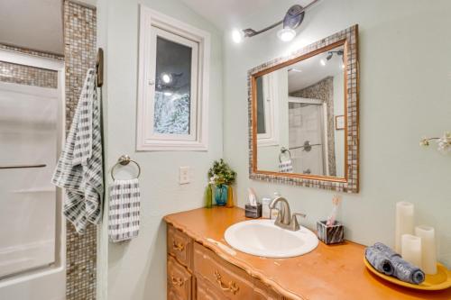 a bathroom with a sink and a mirror at Hot Tub, Trails, Views! Little River Retreat in Sunshine