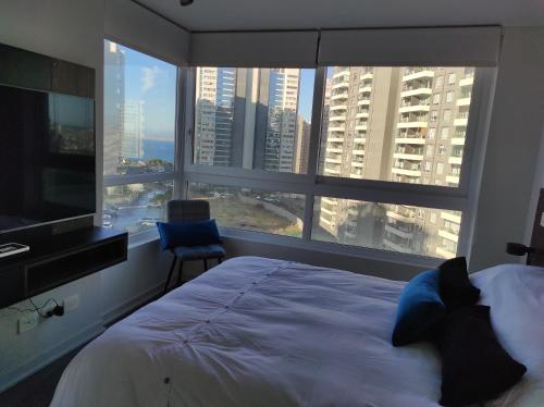 Ένα ή περισσότερα κρεβάτια σε δωμάτιο στο Sunset Arena Concón