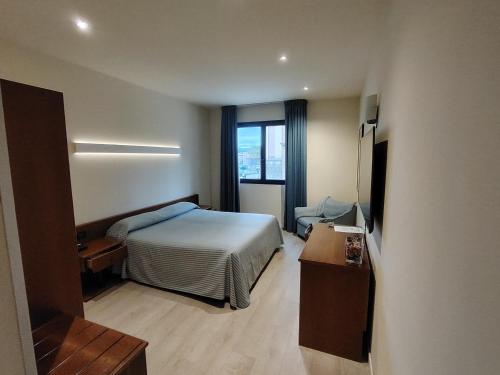 Ένα ή περισσότερα κρεβάτια σε δωμάτιο στο Albergo Centrale