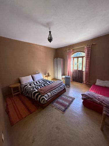 Ένα ή περισσότερα κρεβάτια σε δωμάτιο στο Guest House Tigminou