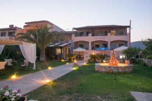 a house with a yard with a garden with lights at Land of Gods in Gythio