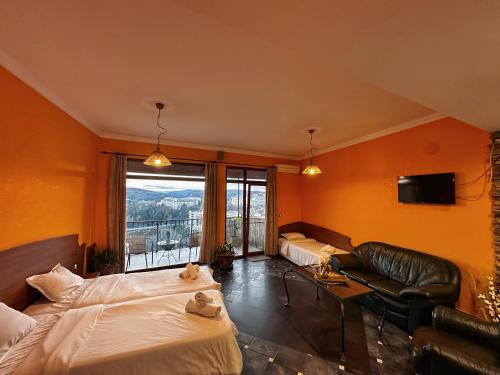 En eller flere senge i et værelse på Art House