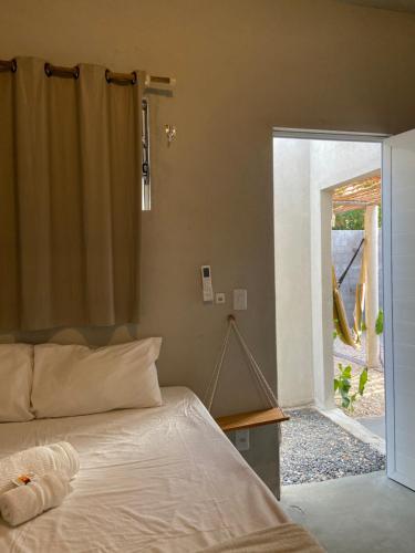 Postel nebo postele na pokoji v ubytování Aratu Pousada