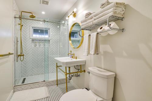 a bathroom with a toilet and a sink and a shower at Pet-Friendly Group Getaway 12 Mi to Camelback Mtn! in Mountainhome