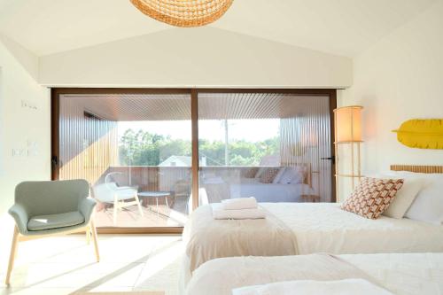 Postel nebo postele na pokoji v ubytování Casa do Lanjal