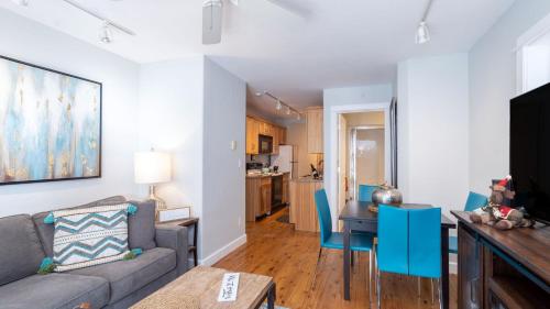 a living room with a couch and a table at Viking Lodge 103 by AvantStay Stunning Condo Near Ski Lift in Telluride