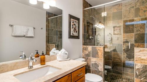 a bathroom with a sink and a shower at Riverside Condos C202 by AvantStay Condo Close To Downtown Town Park Ski Lift 8 in Telluride