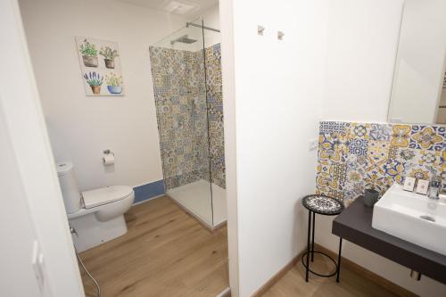 a bathroom with a toilet and a sink and a shower at Trapani Rooms 155 Self Check in in Trapani