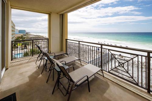 a balcony with chairs and a view of the beach at Bella Riva 301 Large Gulf Front condo in Fort Walton Beach