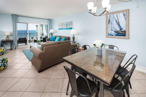a living room with a table and a couch at Emerald Isle 610 Beach Front condo in Fort Walton Beach