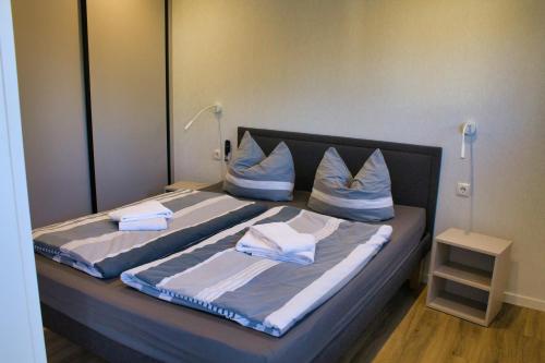 Ένα ή περισσότερα κρεβάτια σε δωμάτιο στο Ferienhaus Noa