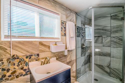 a bathroom with a sink and a shower at Tiny Home with a Huge View in Ruidoso