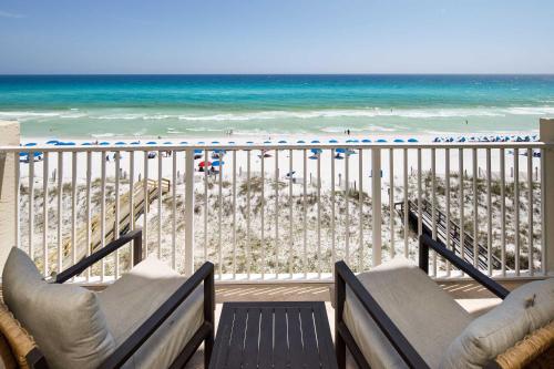 a balcony with a view of the beach at Gulf Side 602 Pet friendly gulf front condo in Fort Walton Beach