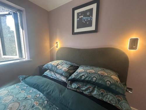 a bedroom with a bed with a pillow on it at One bed mews in Dublin