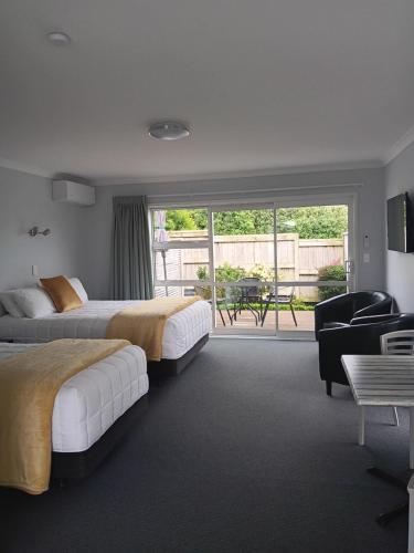 Ένα ή περισσότερα κρεβάτια σε δωμάτιο στο Trailblazer Studios