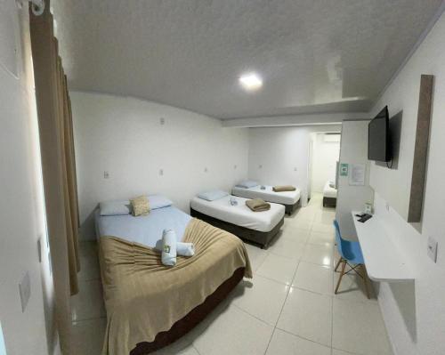 Кровать или кровати в номере Pousada Graff