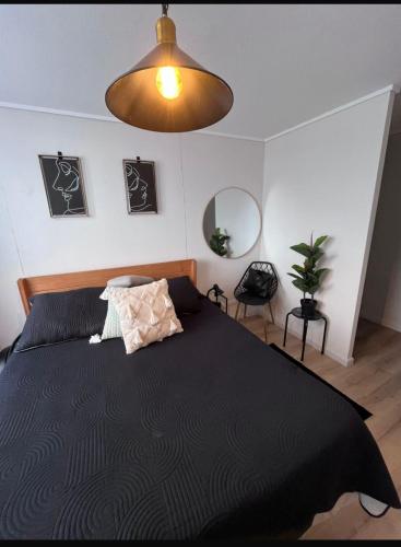 En eller flere senge i et værelse på Apartamento central en Puerto Montt