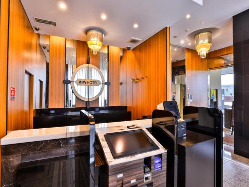 a salon with a desk with a cash register at APA Hotel Nihonbashi Hamacho Ekiminami in Tokyo