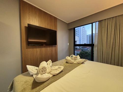 Ένα ή περισσότερα κρεβάτια σε δωμάτιο στο Move Tambaú Studio Rooftop Piscina Prox Praia