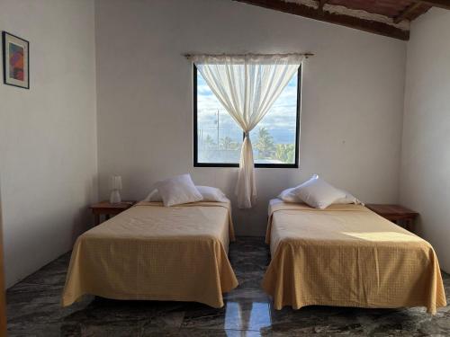 Postel nebo postele na pokoji v ubytování Luisa Rodriguez