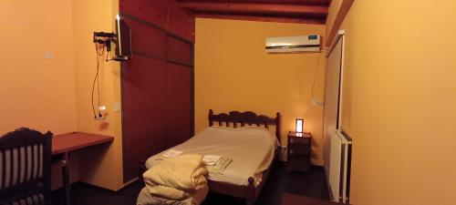 En eller flere senge i et værelse på Casa de Nico