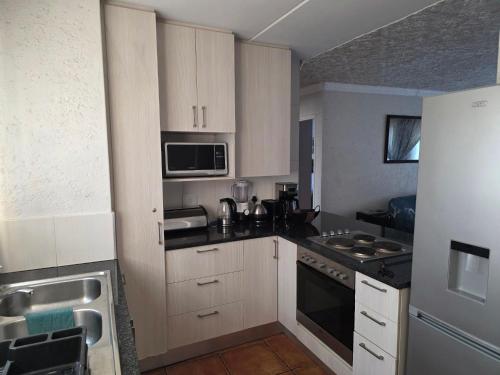 Køkken eller tekøkken på The Urban Dessert "Comfort and Convenience Merged"