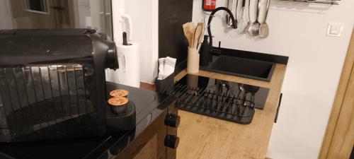 Η κουζίνα ή μικρή κουζίνα στο Drzewna Apartamenty-Wojska Polskiego