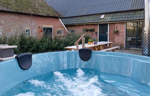 a swimming pool in the middle of a yard at Hoeve Aan De Waddenzee in Wierum