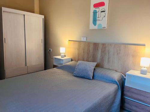 En eller flere senge i et værelse på Apart Los Laureles Dpto 2