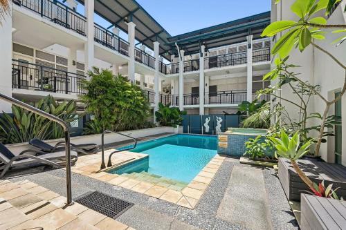 an apartment with a swimming pool in a building at Paradiso Resort by Kingscliff Accommodation in Kingscliff
