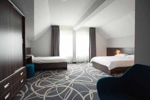 Кровать или кровати в номере Hotel Nad Nettą