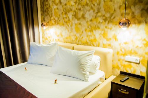 Postel nebo postele na pokoji v ubytování Cluj Business Class