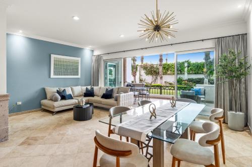 a living room with a table and chairs at Beautiful Apartment a few of minutes to the Beach in Cabo San Lucas