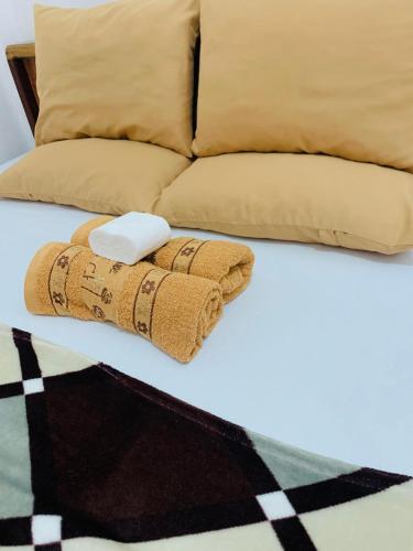 En eller flere senge i et værelse på Queen's Room Rental 1