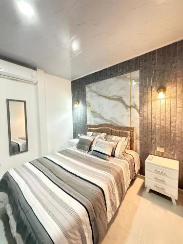 Ένα ή περισσότερα κρεβάτια σε δωμάτιο στο Orinoquía Comfort Suite