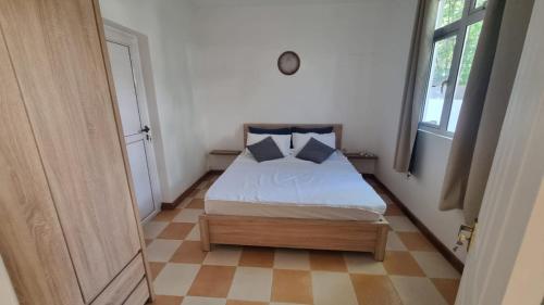 Un pat sau paturi într-o cameră la L'Escapade - Residence Harmonie