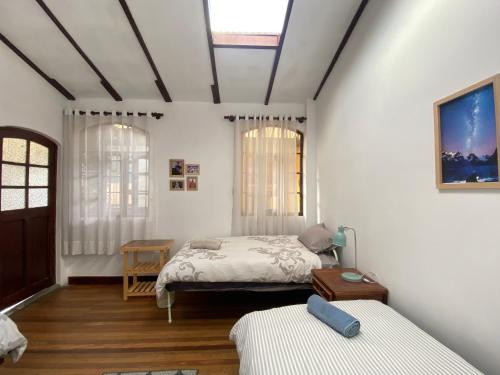 En eller flere senge i et værelse på Casa Colonial 924