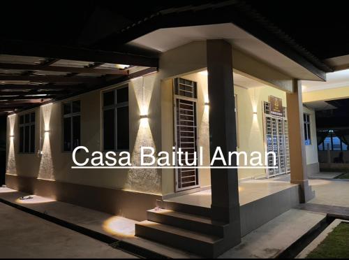a house with lights on the side of it at Casa Baitul Aman in Kuala Terengganu