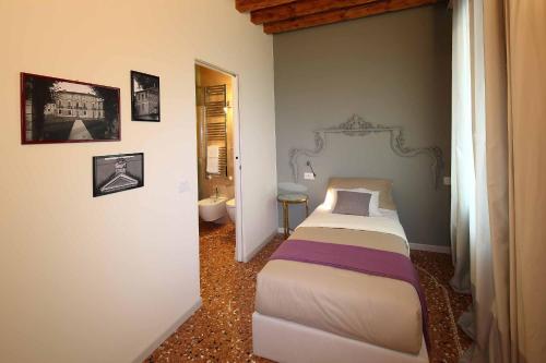 Ein Bett oder Betten in einem Zimmer der Unterkunft Le Andrianelle