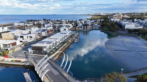 an aerial view of a city with a river and buildings at Maraboo Island - Luxury, Beachfront, family friendly, Sauna, close to Fremantle & Rottnest Island Ferry in Coogee