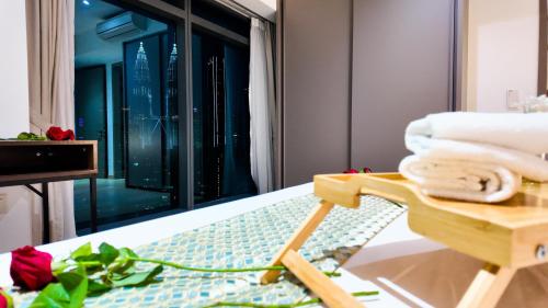 a hotel room with a view of the city at Eaton Residence KLCC - J Home in Kuala Lumpur