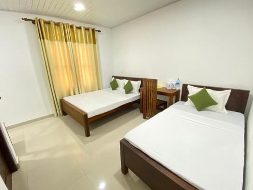 Ένα ή περισσότερα κρεβάτια σε δωμάτιο στο Premium Cottages B&B