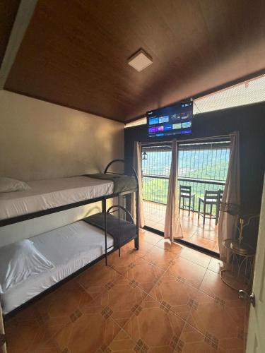 Postel nebo postele na pokoji v ubytování Cabaña Vista al Valle