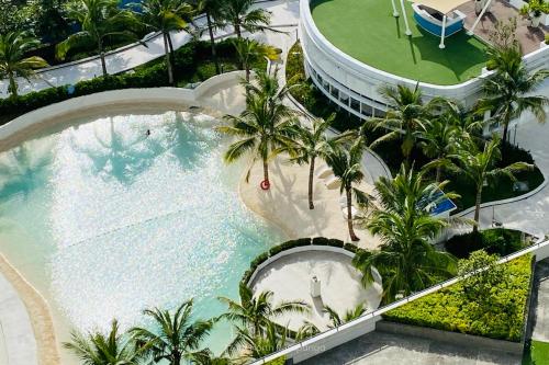 an overhead view of a swimming pool at a resort at Bali Videl - Studio with Queen Bed & Beach View in San Fernando