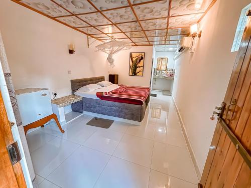 Ένα ή περισσότερα κρεβάτια σε δωμάτιο στο Anu Villa Wadduwa